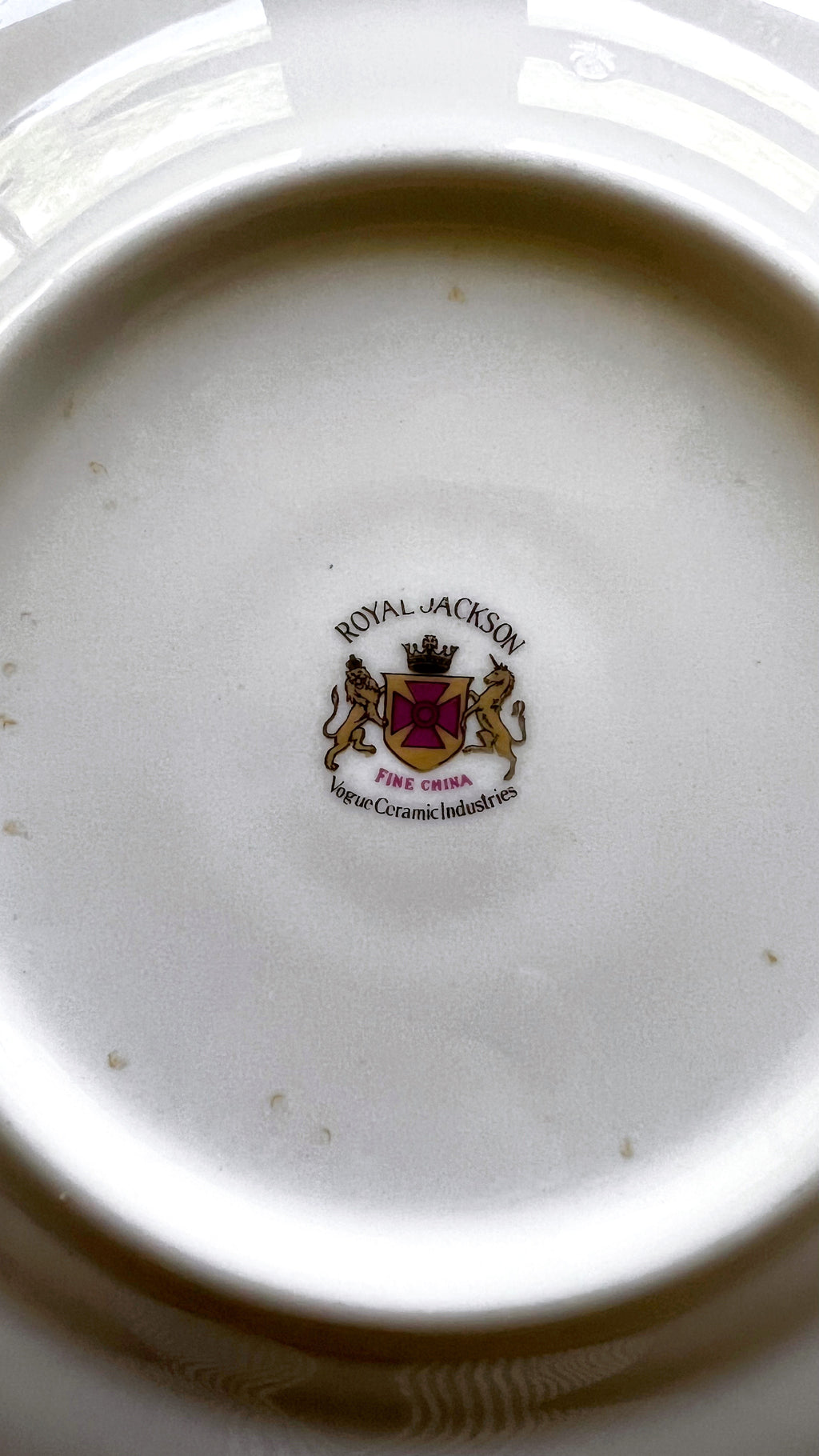 Close-up of a Royal Jackson logo on a ceramic plate