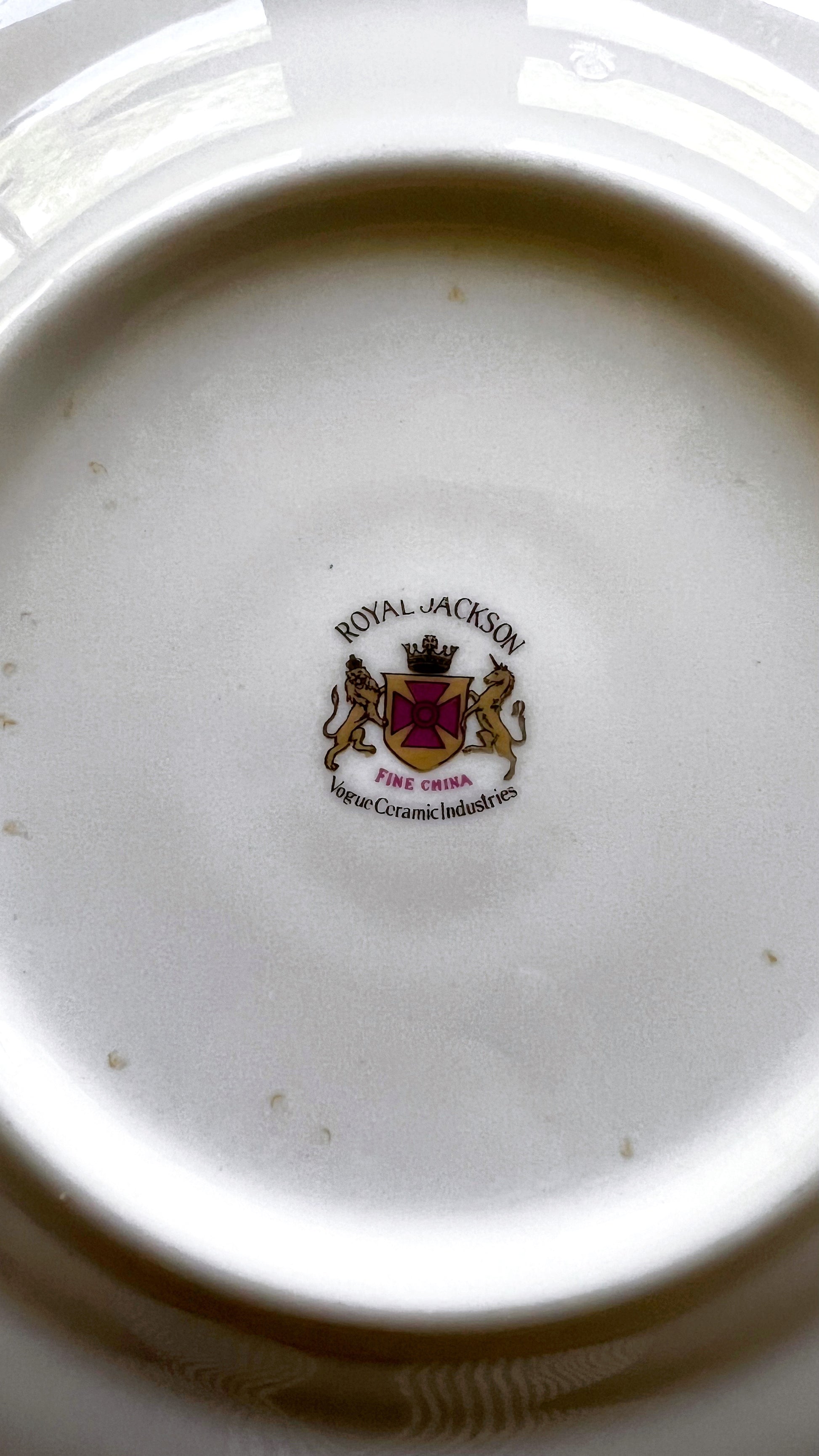 Close-up of a Royal Jackson logo on a ceramic plate
