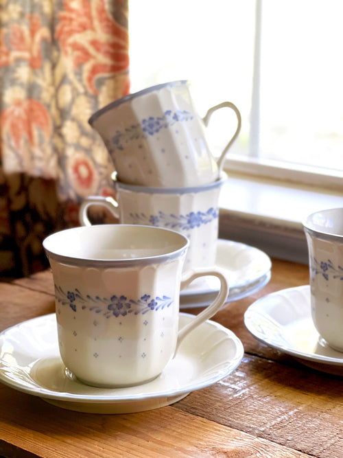 close up view of a set of Sango Arcadia Blue teacups & saucers