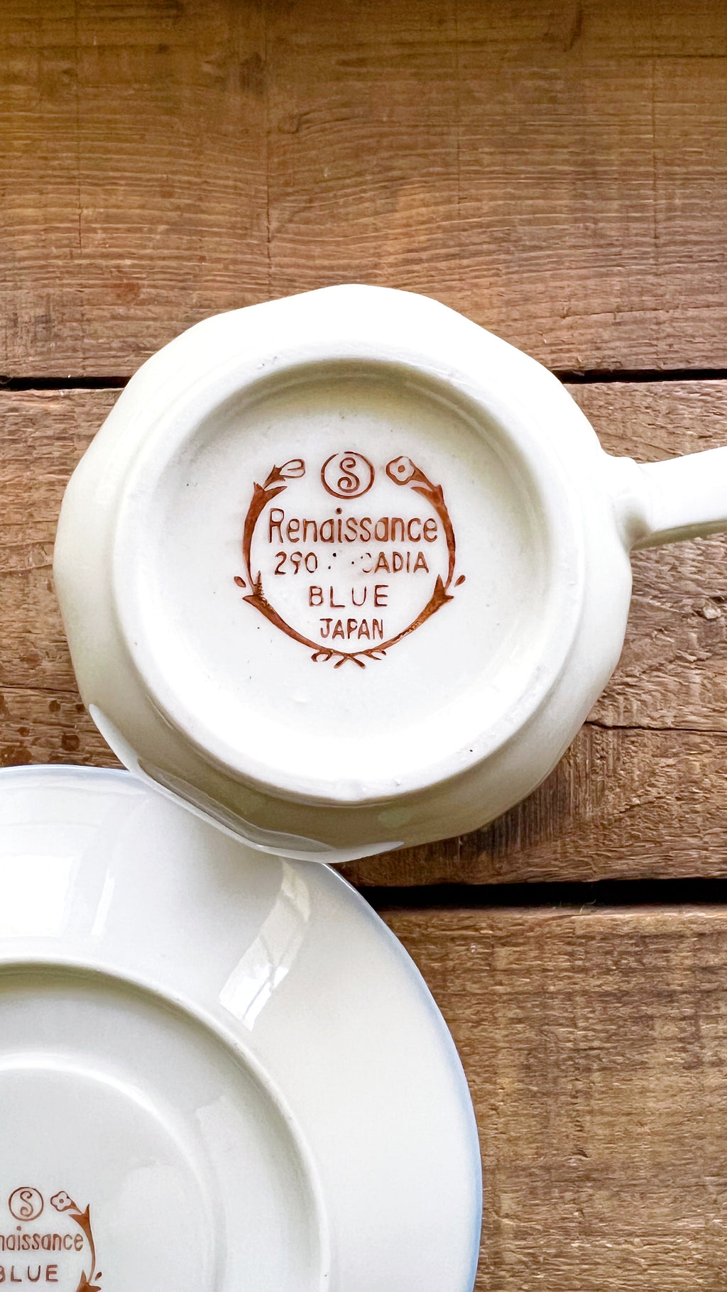 Sango teacup with 'Renaissance' branding on a wooden surface