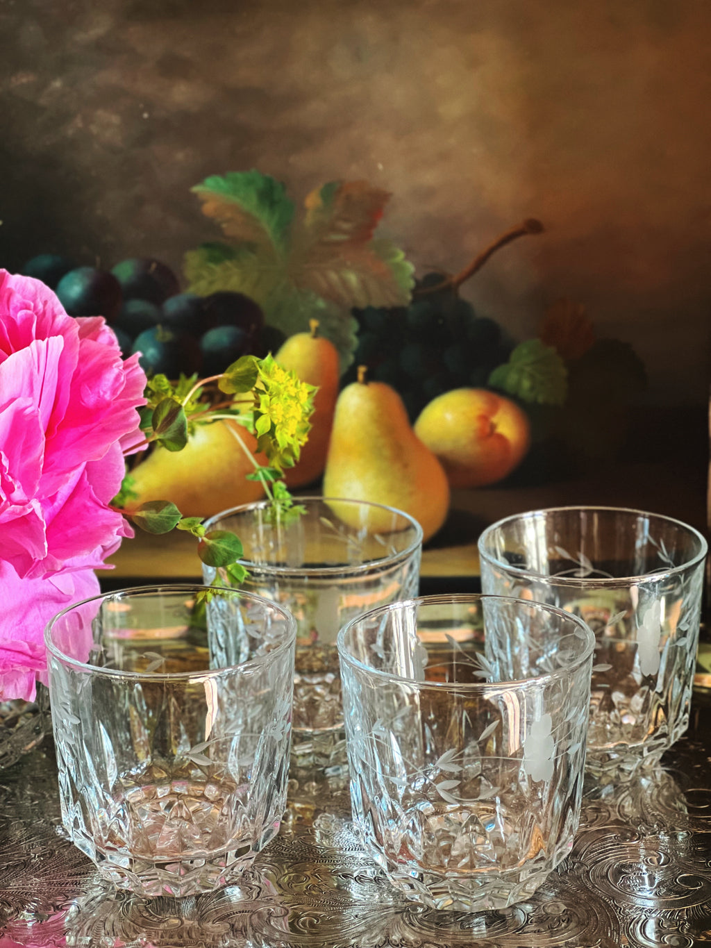 Set of four vintage etched crystal double old fashioned glasses on a silver tray