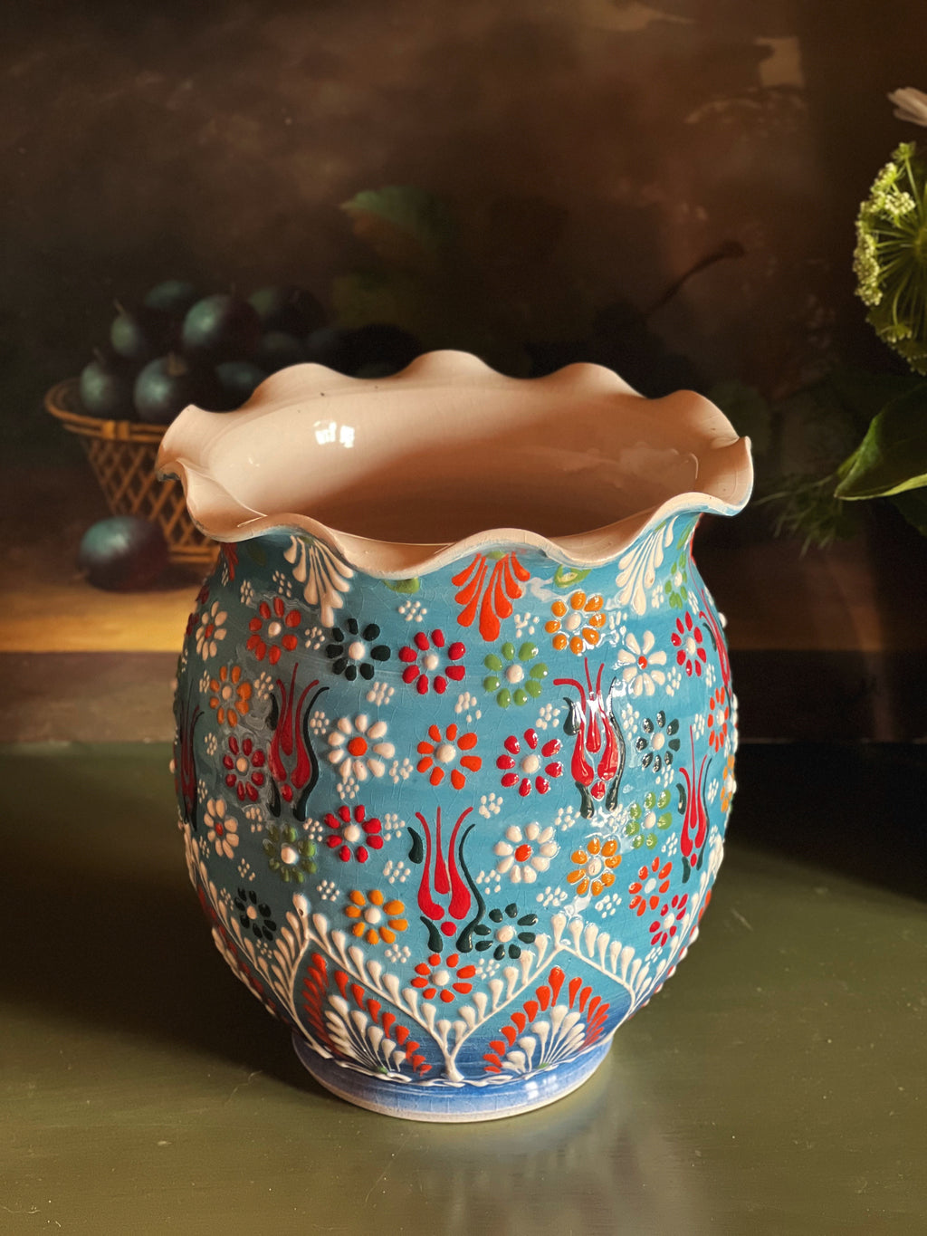 Vintage hand-painted ceramic vase with raised floral decoration and scalloped rim.