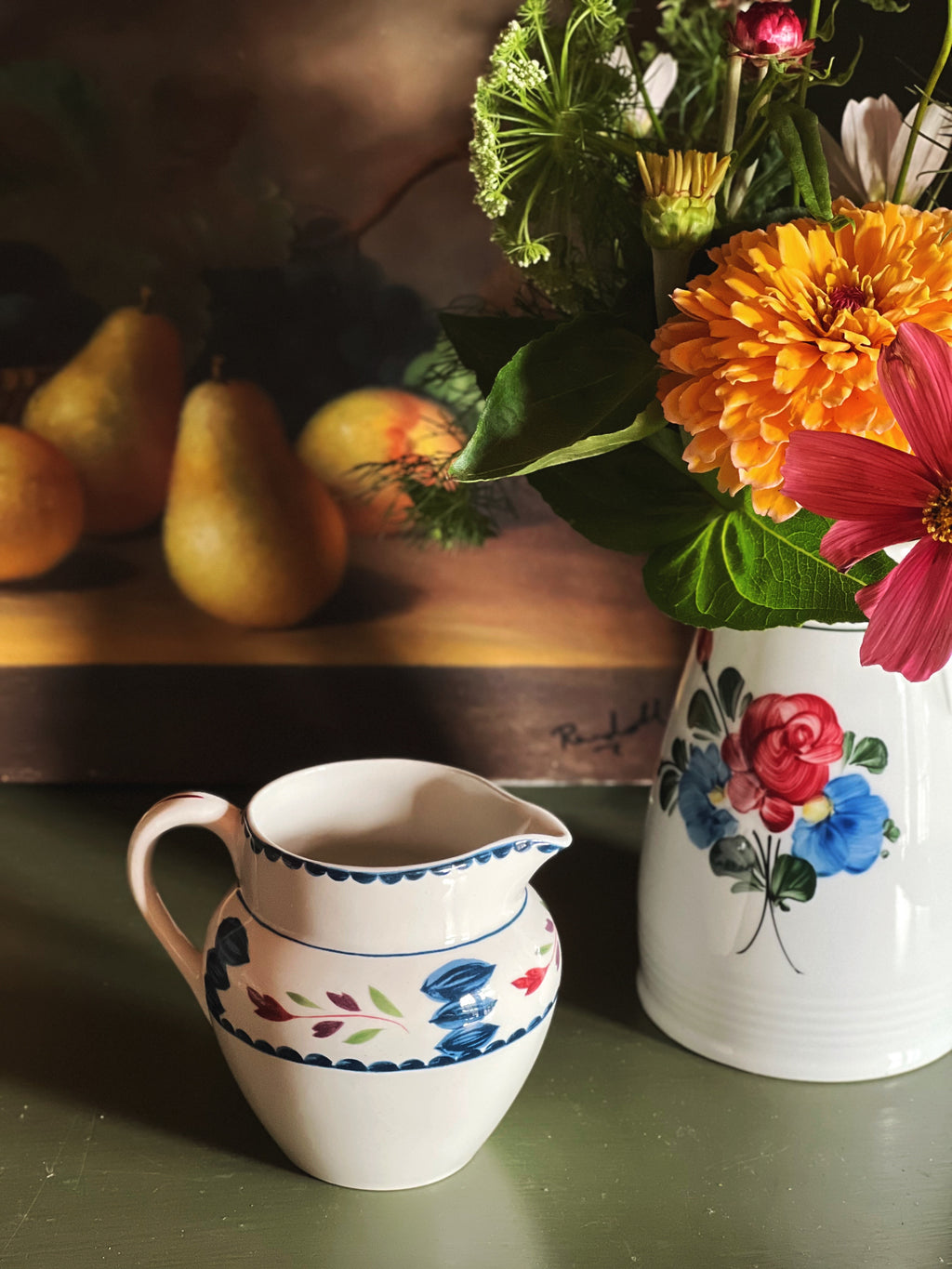 Vintage Adams Lancaster hand-painted English creamer styled beside garden flowers and pears in warm natural light.