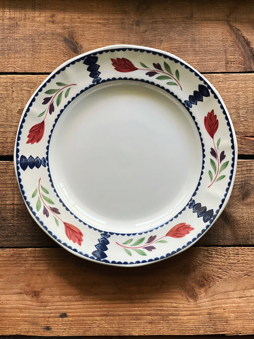 Vintage Adams Lancaster 10-inch hand-painted English dinner plate with floral border displayed on a rustic wooden tabletop.