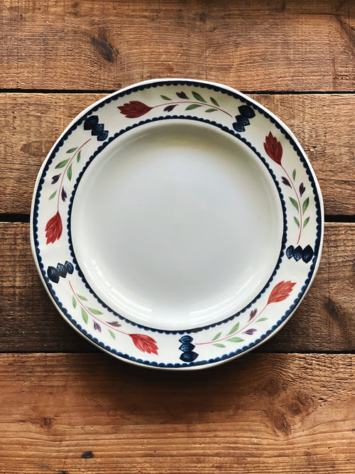 Vintage Adams Lancaster 9-inch hand-painted English luncheon plate with floral border photographed on a rustic wooden tabletop.