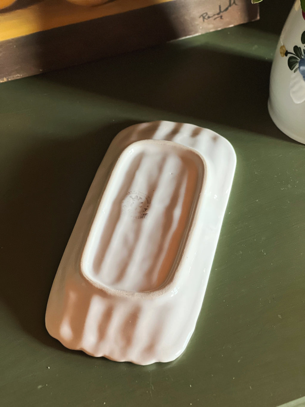 underside of a vintage Bordallo Pinheiro white majolica asparagus serving dish 