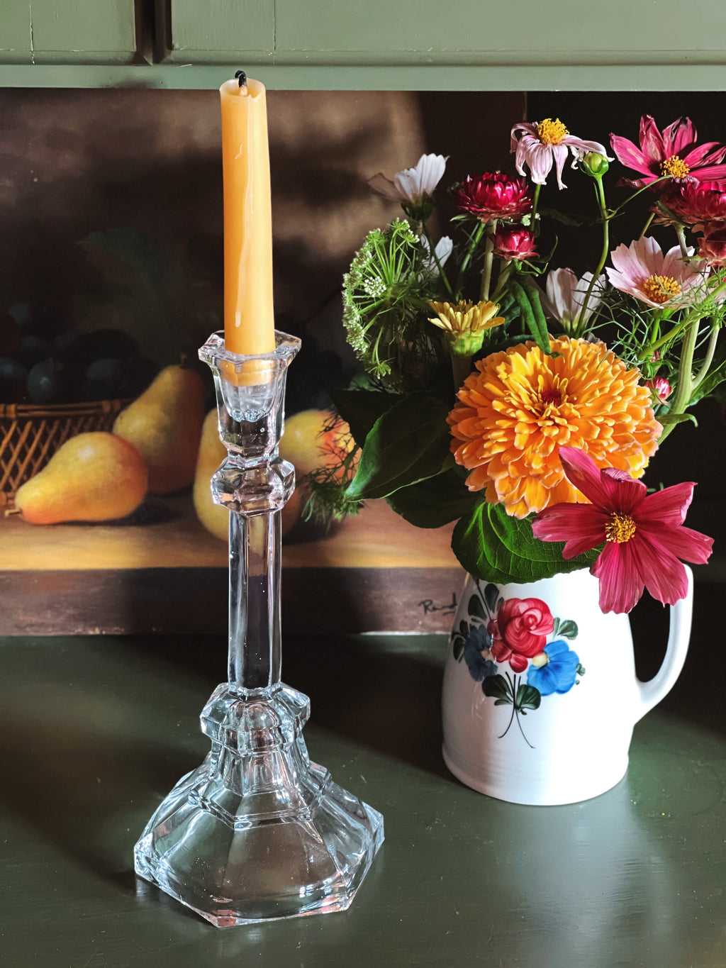 Vintage Pressed Glass Taper Candle Holder on a shelf with a flower arrangement