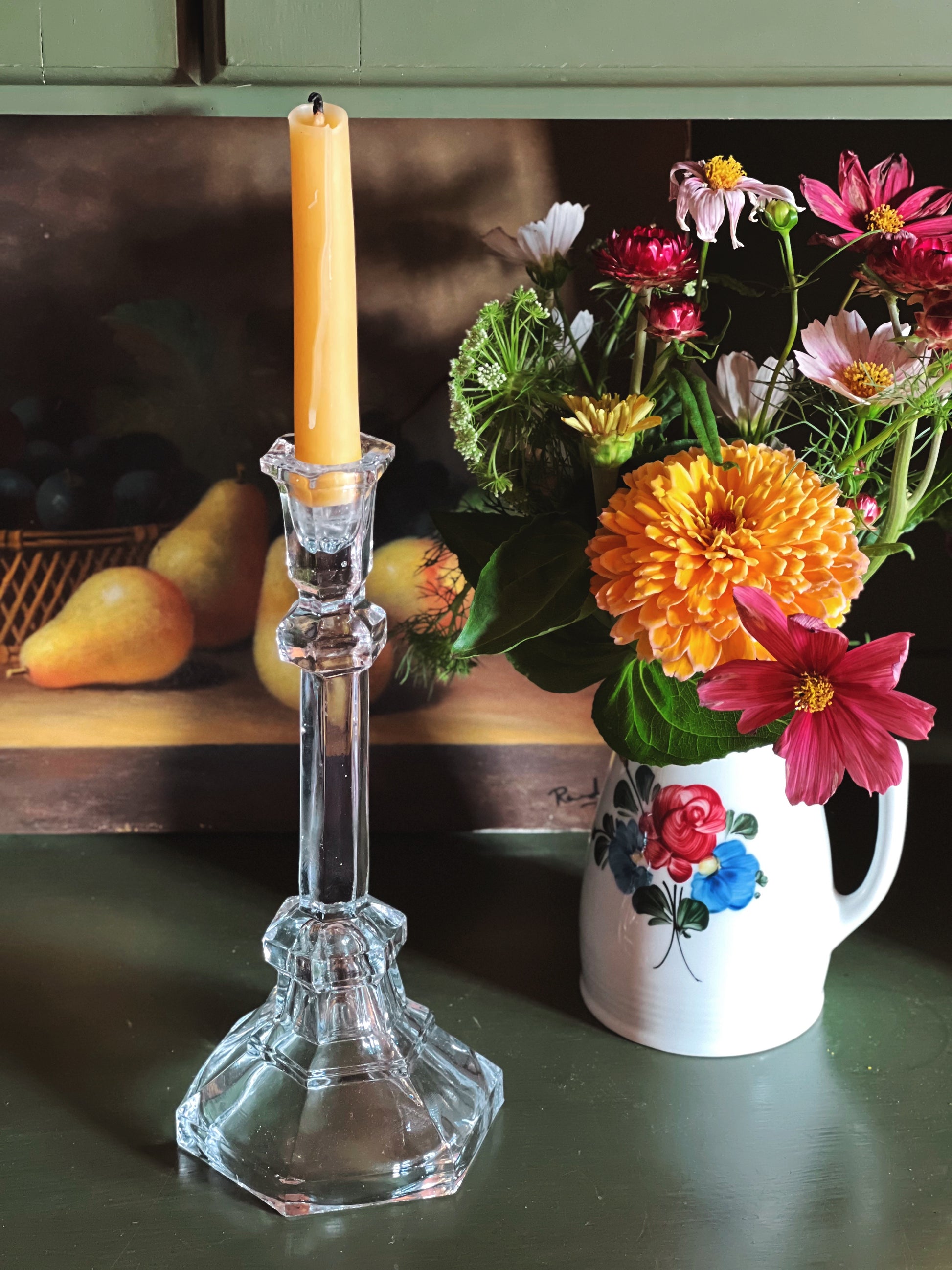 Vintage Pressed Glass Taper Candle Holder on a shelf with a flower arrangement