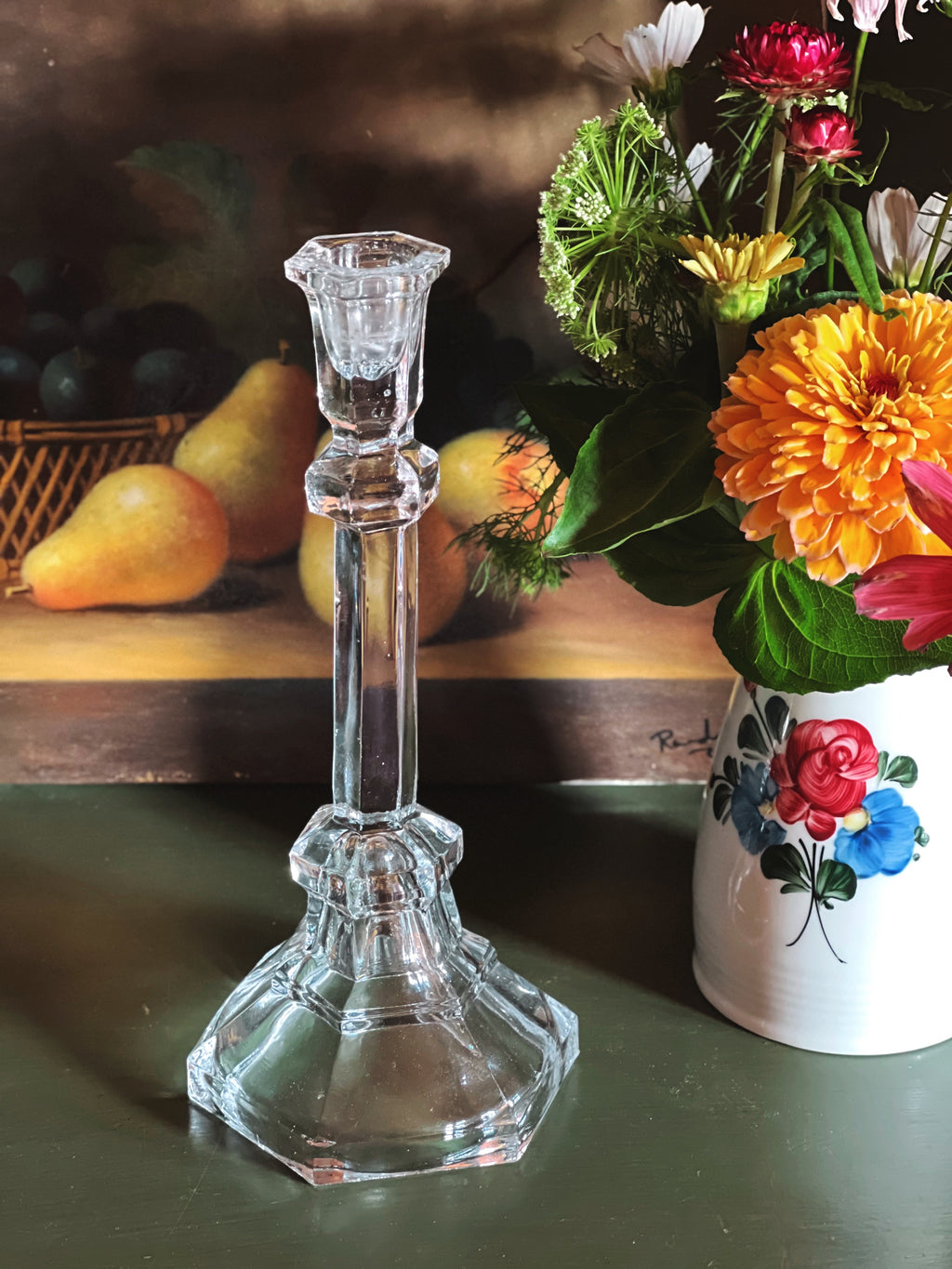 Vintage Pressed Glass Taper Candle Holder next to a flower arrangement