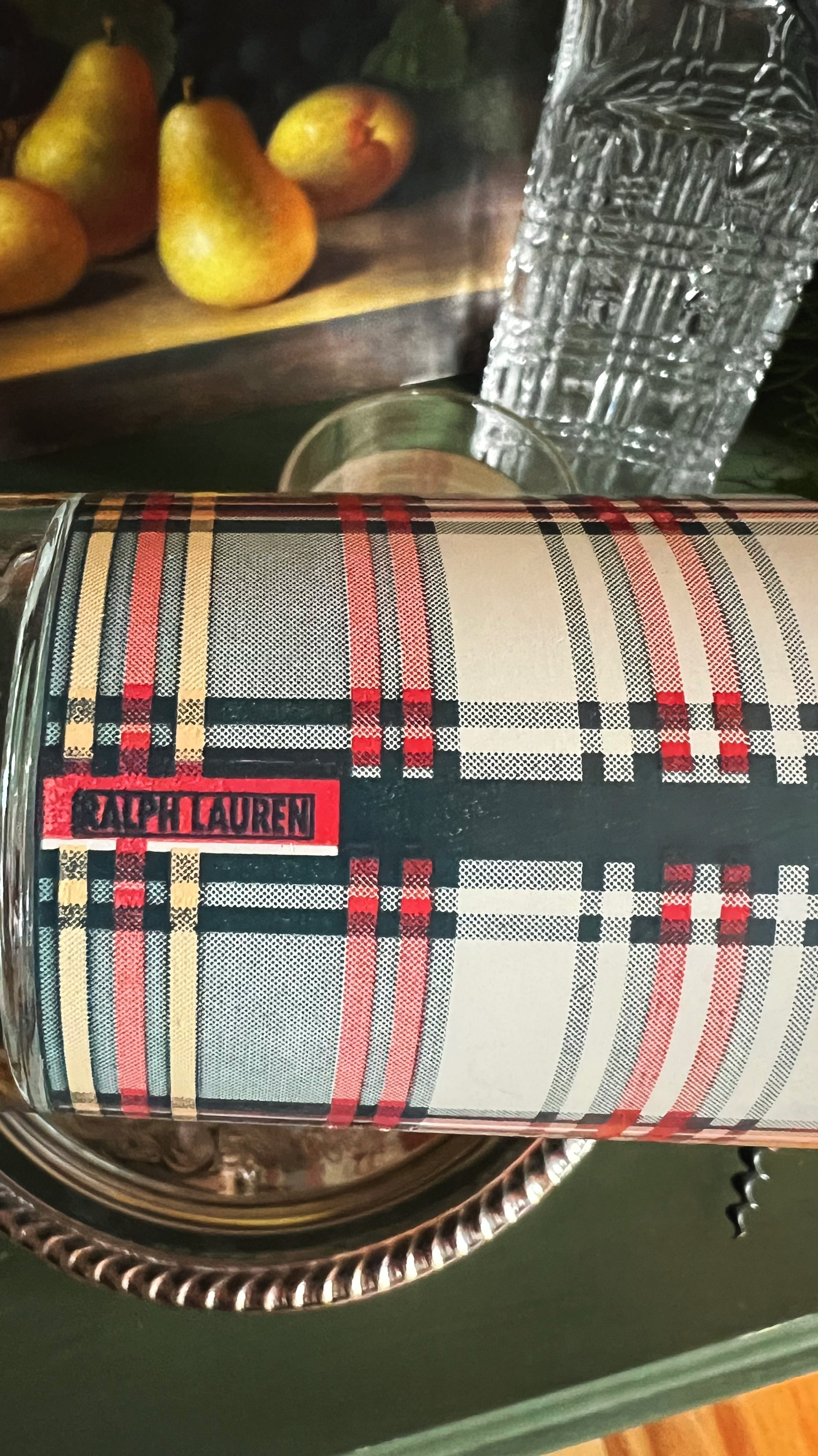 Plaid Ralph Lauren tumbler with pears and a glass in the background