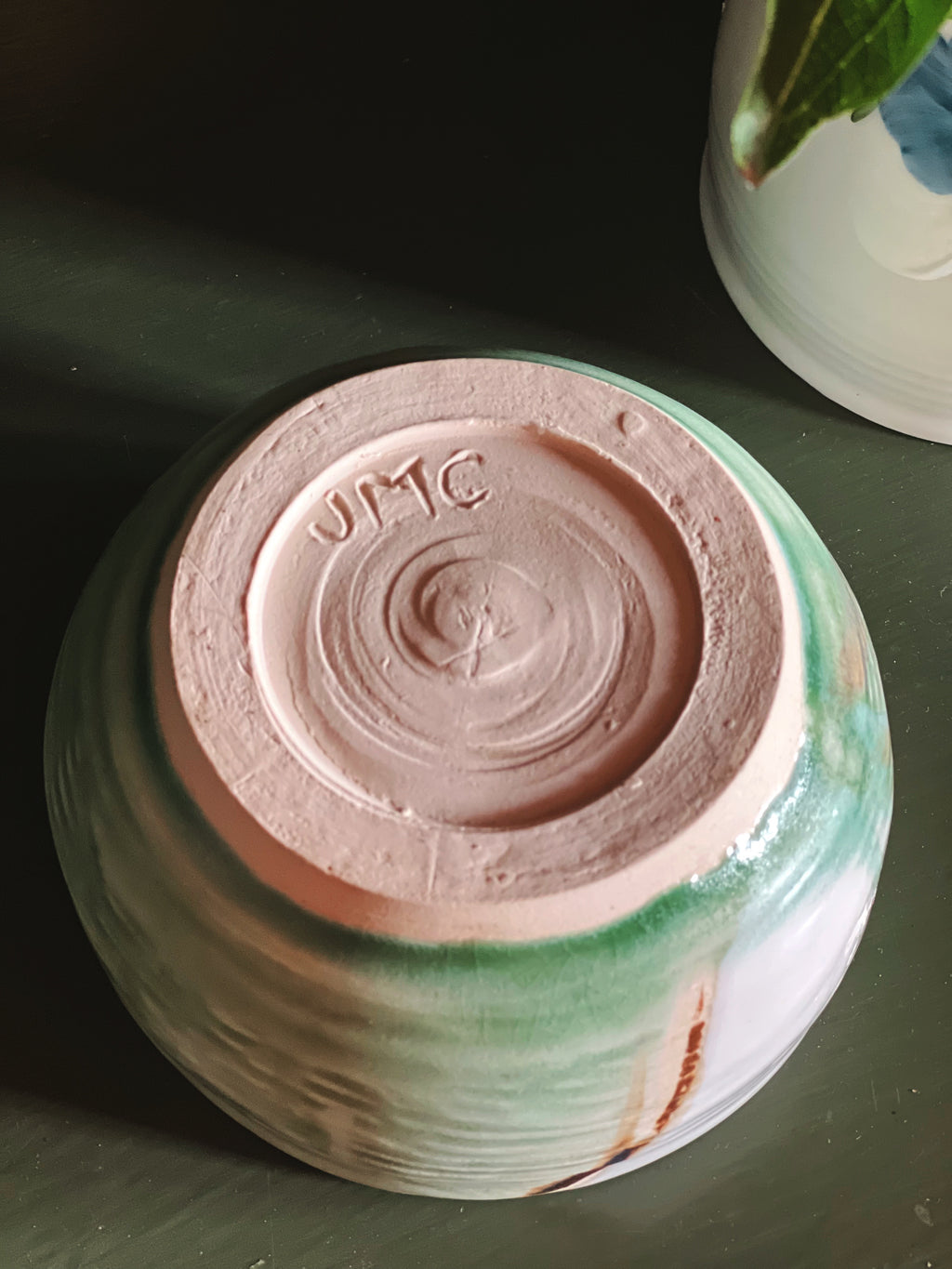 JMC potter's mark on a small handmade bowl