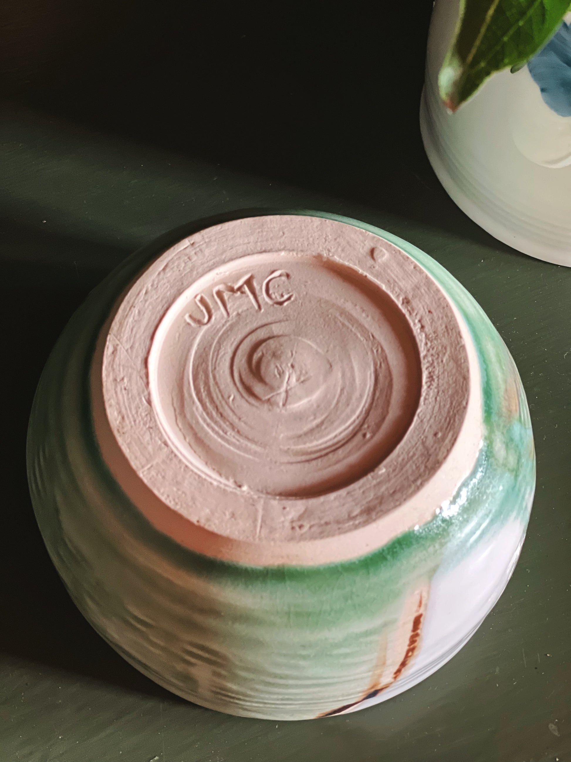 JMC potter's mark on a small handmade bowl