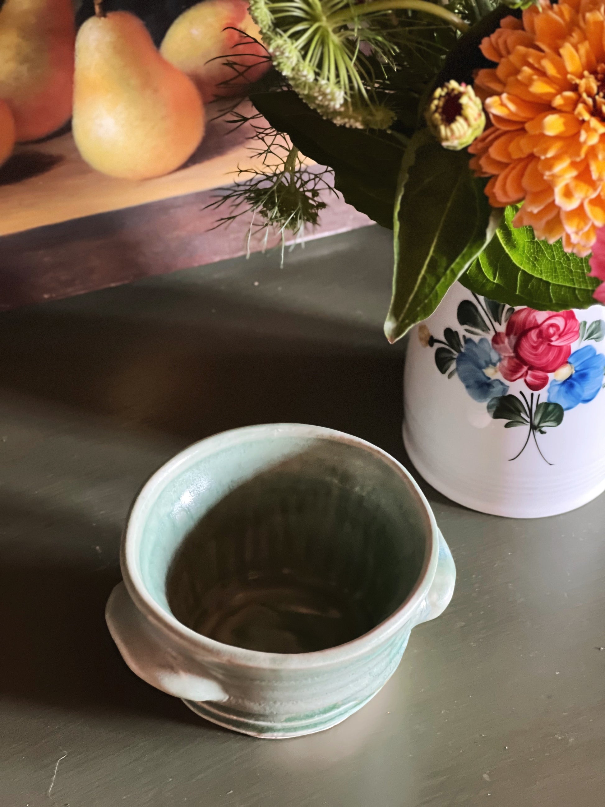 overhead view of a Handmade Green Handled Pottery Bowl 
