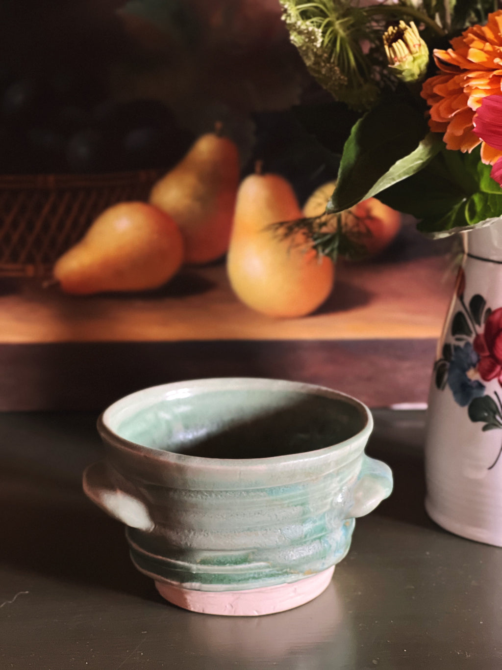 close up of a Handmade Green Handled Pottery Bowl 