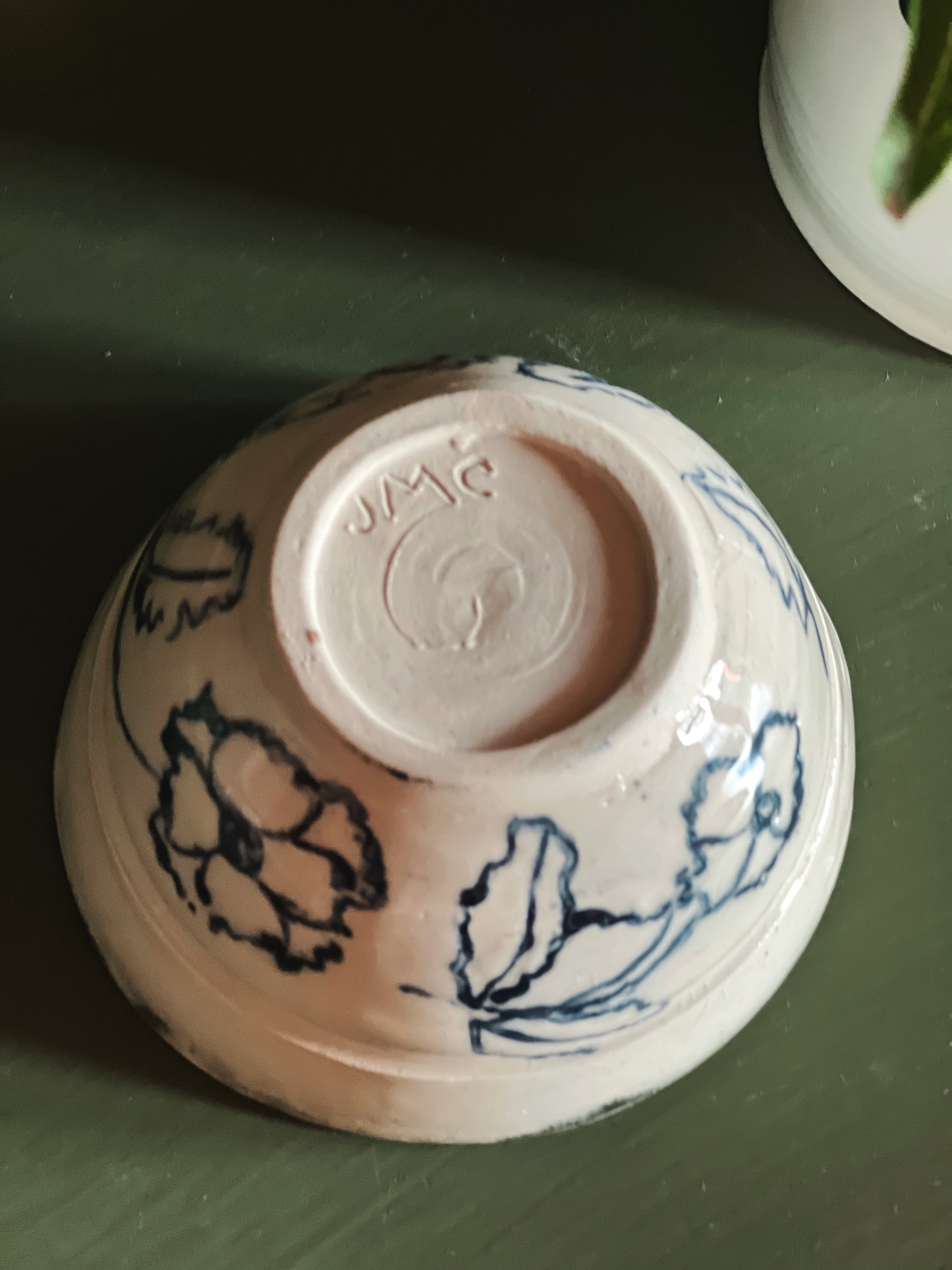 potter's mark on a Handmade Blue Floral Pottery Bowl