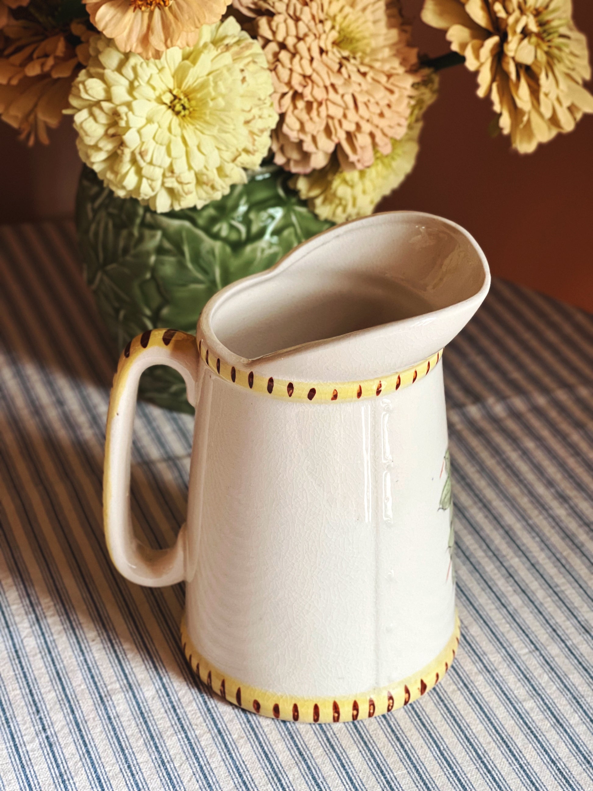 Back side of a Vintage Hand Painted Ceramic Batter Pitcher