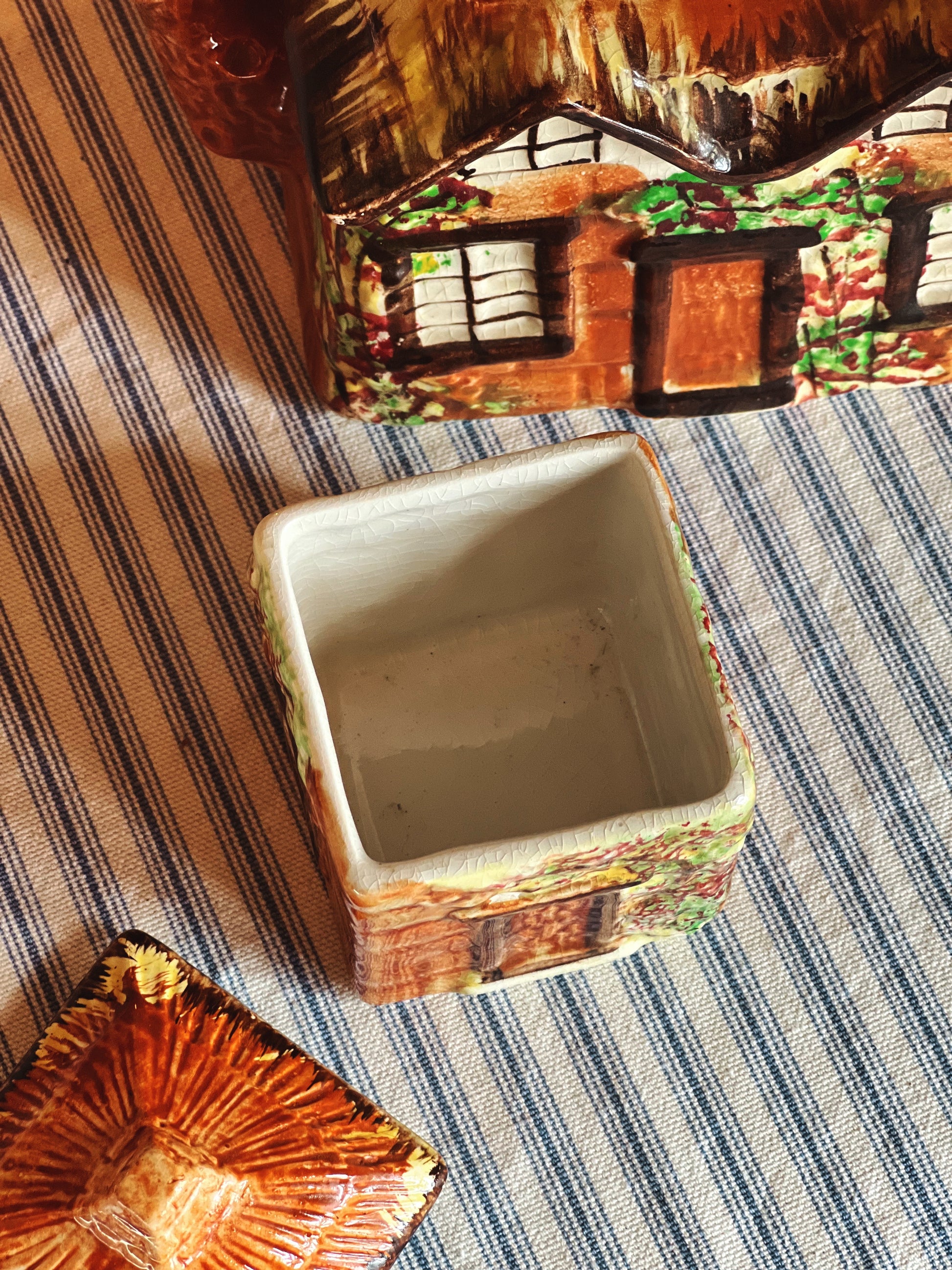 interior of a vintage Price Bros Ye Olde Cottage covered sugar bowl with lid 