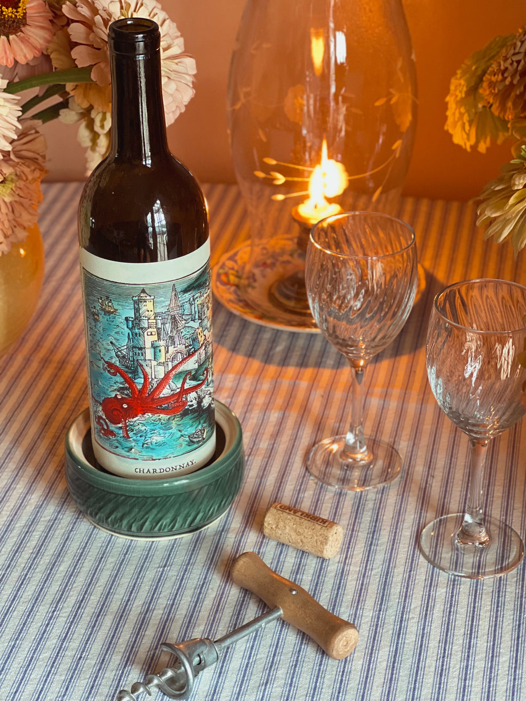 Michael Gershman Handmade Pottery Wine Coaster on a table with wine glasses 