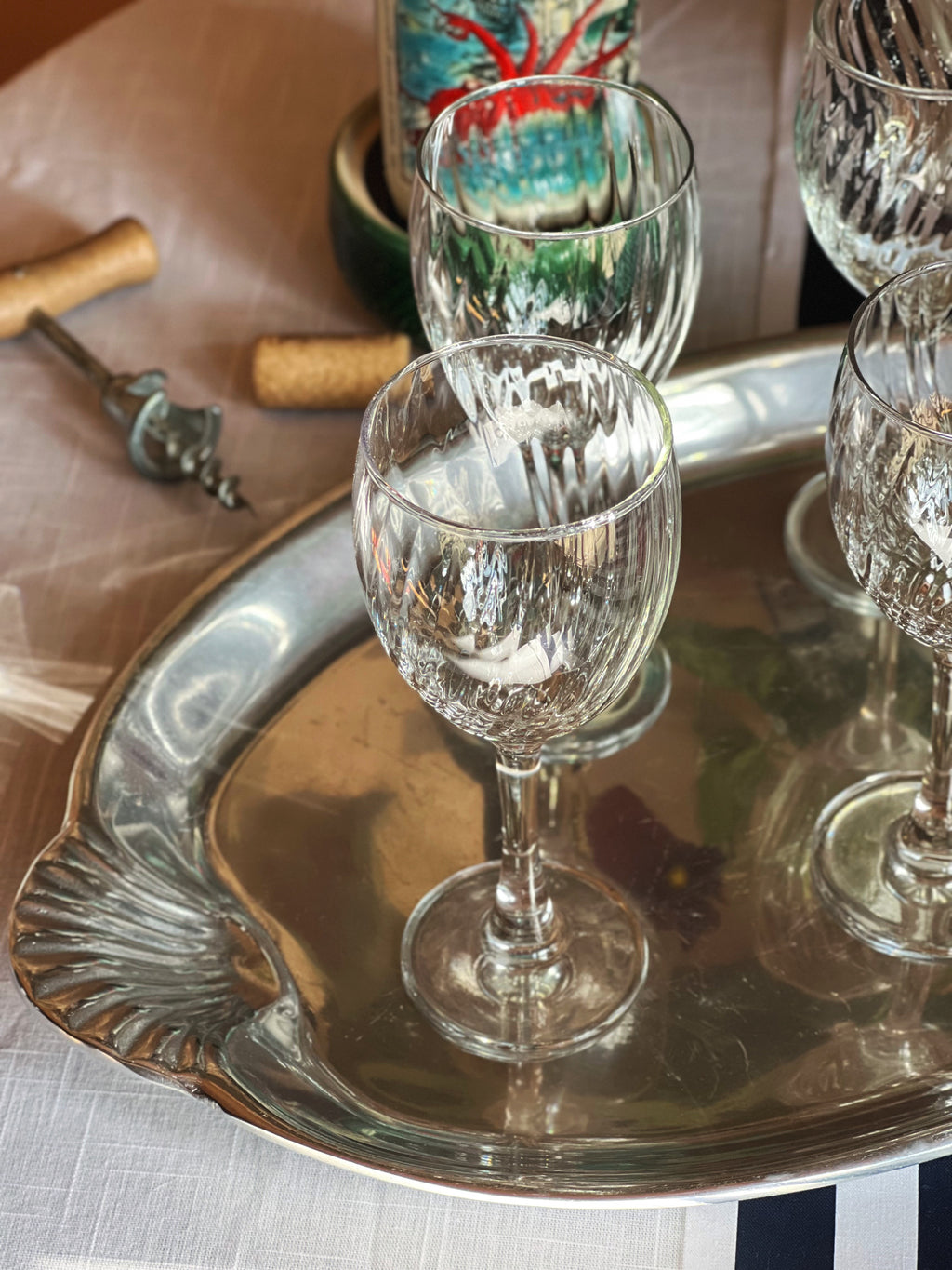 Wilton Armetale platter with scallop shell handles that has French wine glasses on it
