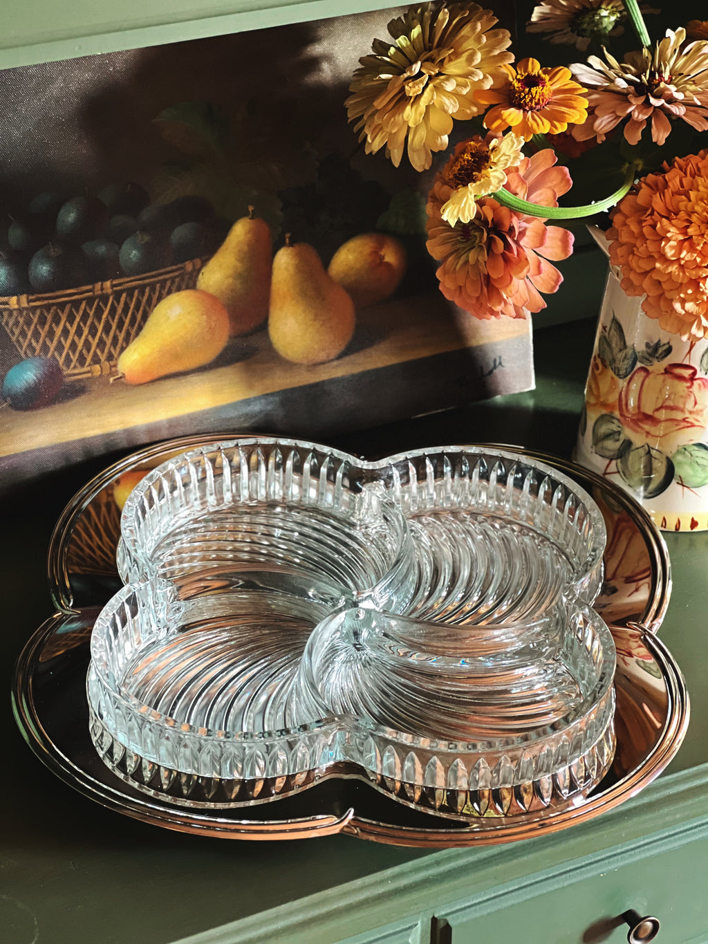 Vintage Godinger Contour Silver Plate Relish Tray with Removable Cut Glass Insert on a shelf with flowers and a still life painting