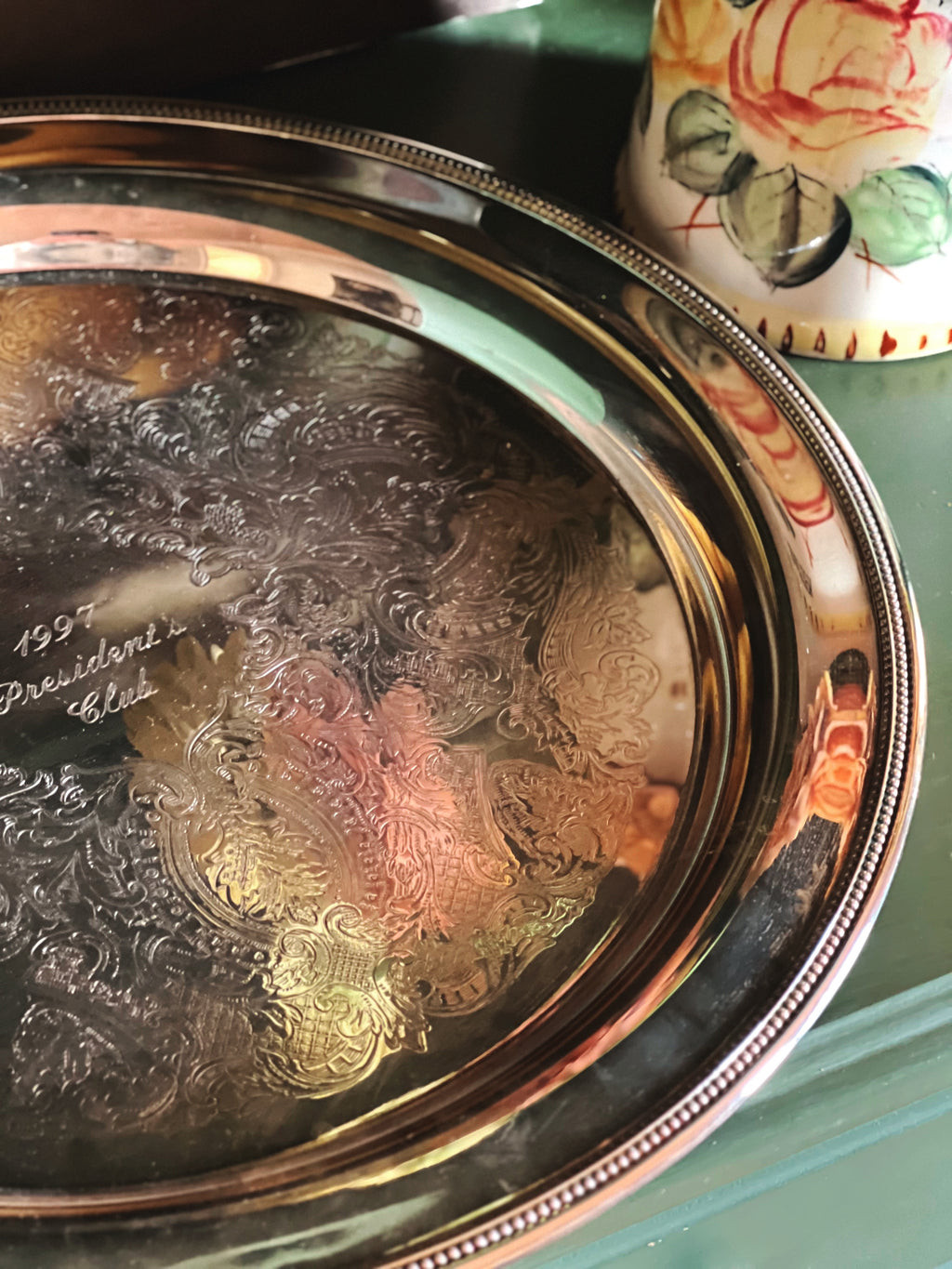 rim detail on a Vintage Oneida Silverplate Round Serving Tray 