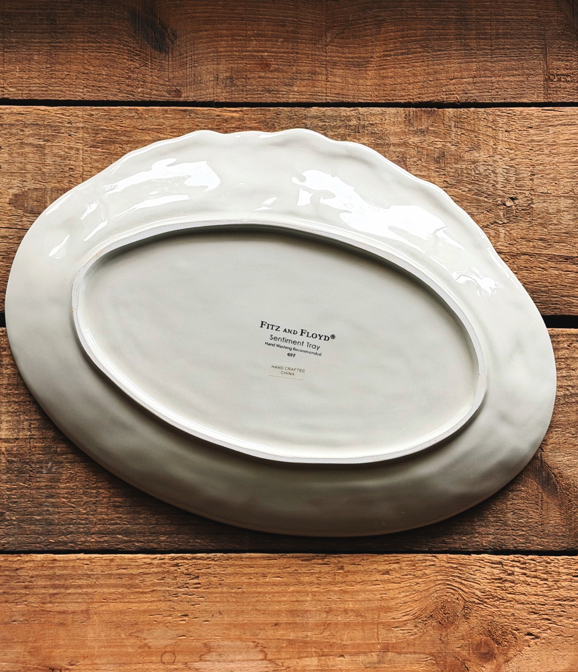 underside of a Vintage Fitz & Floyd holiday sentiment tray 