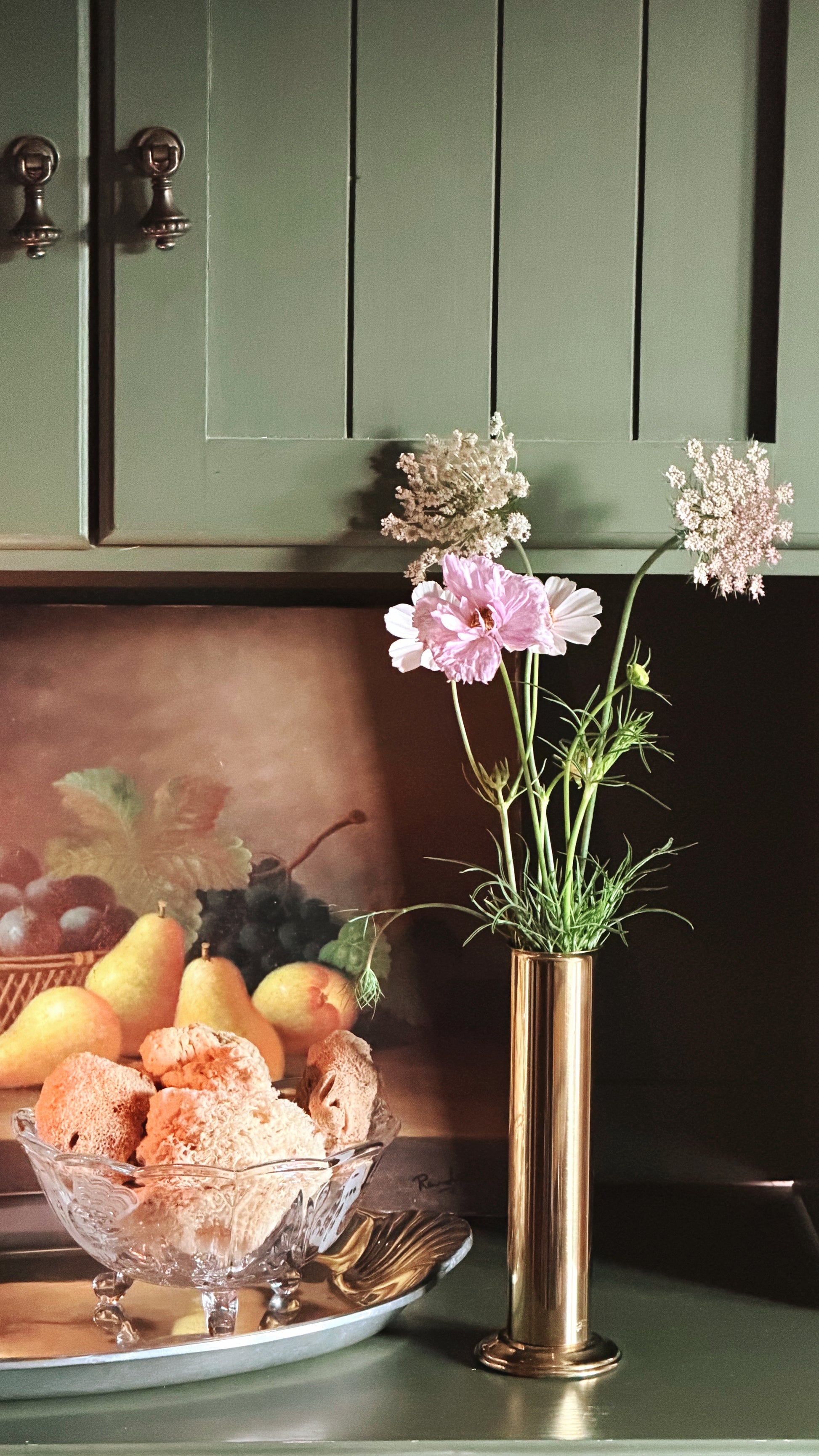 Vintage Brass Cylinder Bud Vase with cosmos and ammi on a green shelf