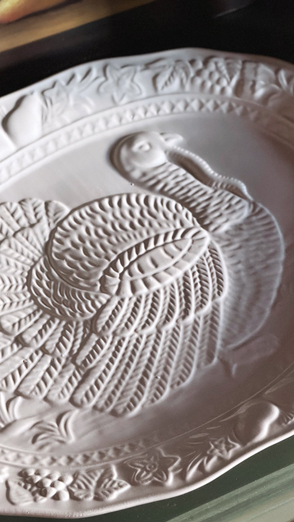 embossed detail of a ceramic turkey design