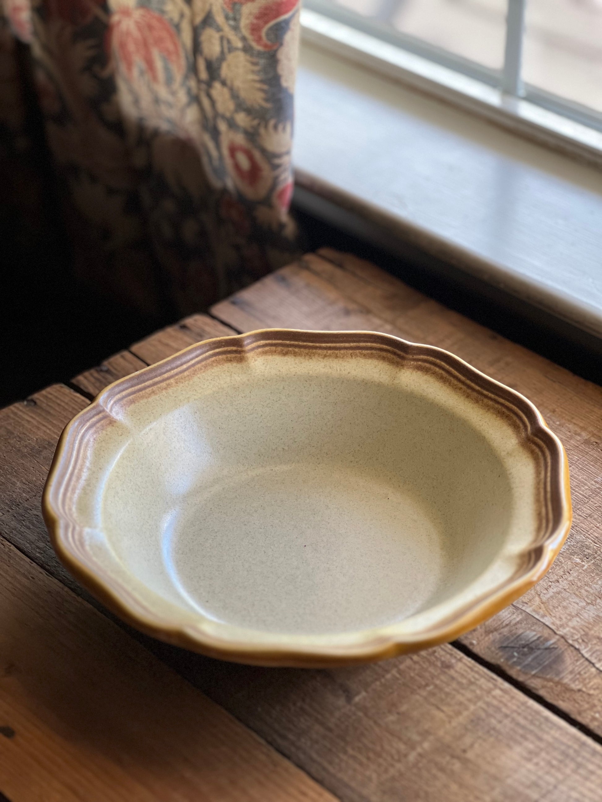 stoneware serving bowl on a wooden surface