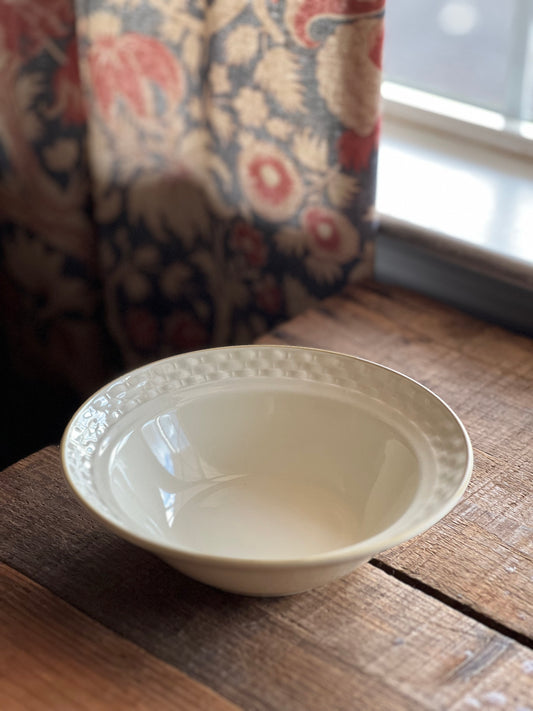 plain stoneware cereal bowl with a basket weave rim