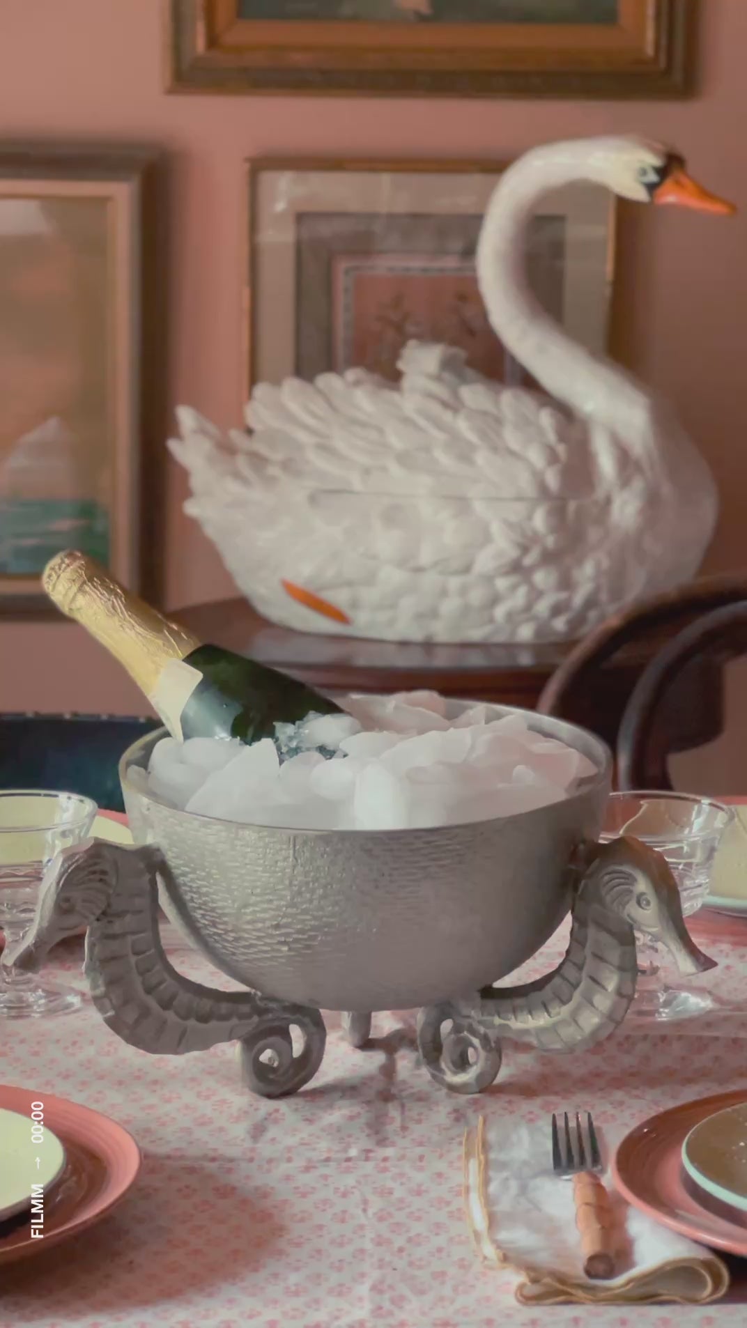 Vintage silver seahorse bowl styled as a wine chiller for entertaining