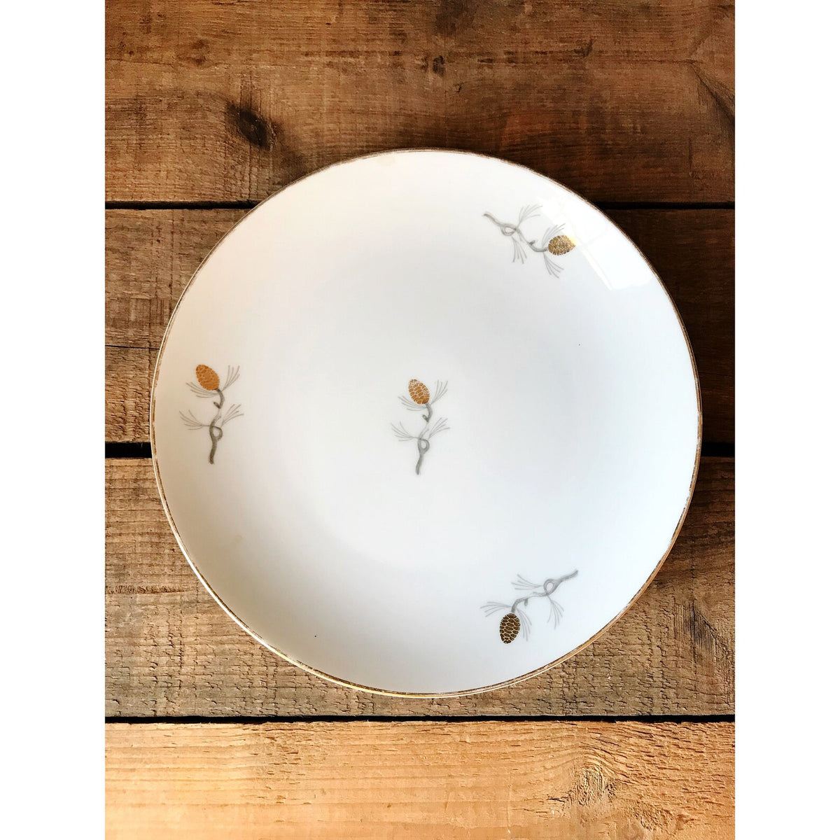 Vintage Sone China Japan Pinecone Salad Plate on a wooden surface